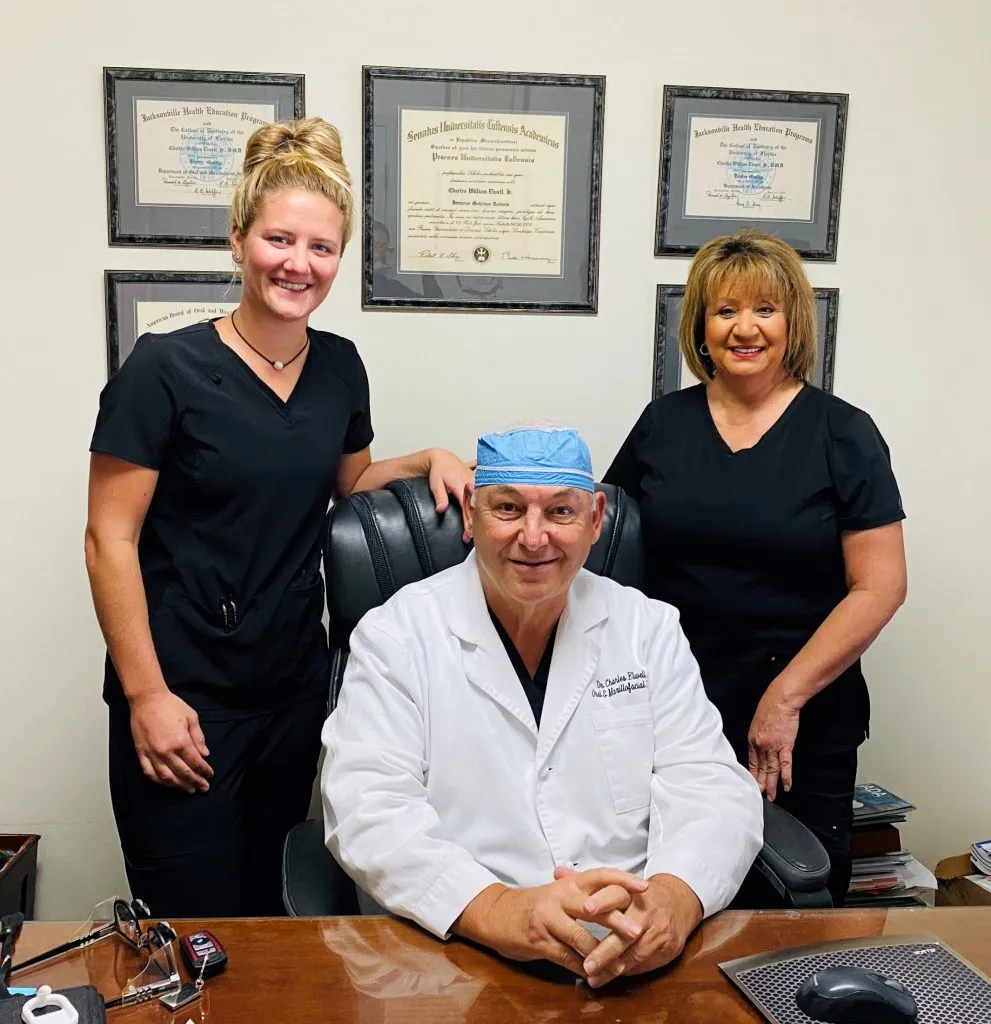 Dr. Charles Elwel and two staff members